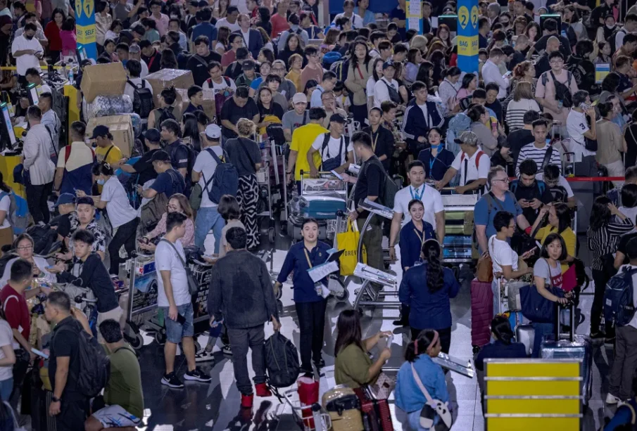 Long queues of passengers form at the check-in counters in Manila, Philippines, due to a July 19 computer outage caused by cybersecurity firm CrowdStrike. Ezra Acayan/Getty Images